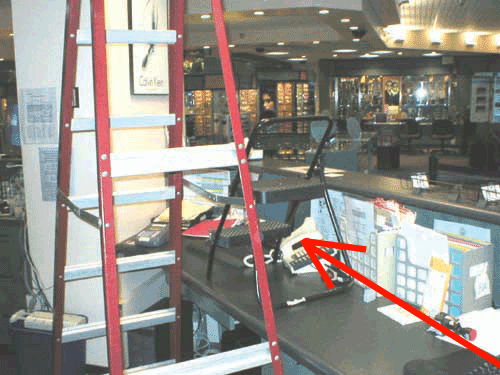 an open ladder next to an open step ladder sitting on a countertop