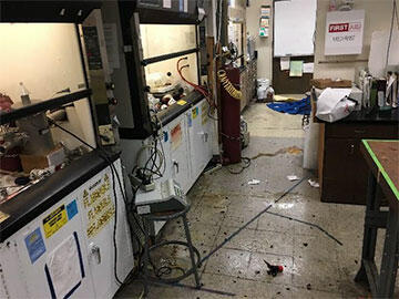 Broken glass littered across Lab Space after over-pressurization